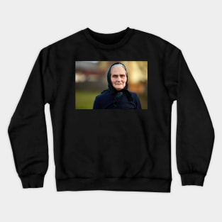 Closeup of an old woman outdoor Crewneck Sweatshirt